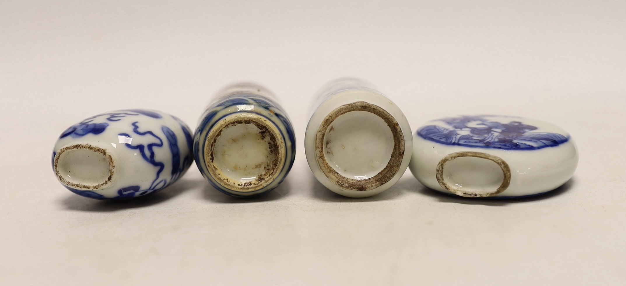 Three 19th century Chinese blue and white snuff bottles, and a similar underglaze blue and copper red Dragon snuff bottle, tallest 8cm